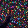 Christmas Lights Wall Hand in Darkness