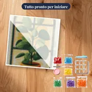 Pianta verde da interno davanti alla finestra Diamond Painting – kit pronto per iniziare