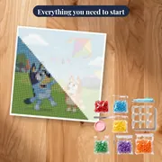 Bluey and Bingo Flying a Kite on a Windy Hill – kit ready to start
