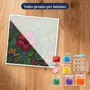 Camaleonte sull'ibisco rosso in giardino tropicale – kit pronto per iniziare