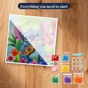 Grinning Stitch Seated Among Plumeria Blooms – kit ready to start