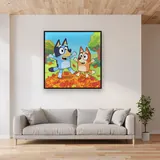 Bluey and Bingo Jumping in Autumn Leaves – displayed in a living room
