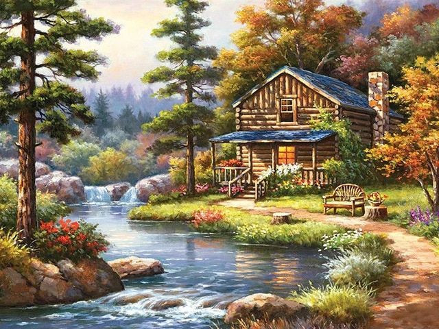 Preview van het eindresultaat van de diamond painting 'Herfstchalet aan de rivier'.